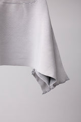 SEAMLESS DEFORMED DOLMAN SLEEVE/RIB