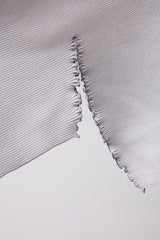 SEAMLESS DEFORMED DOLMAN SLEEVE/RIB