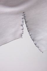 SEAMLESS DEFORMED DOLMAN SLEEVE/RIB