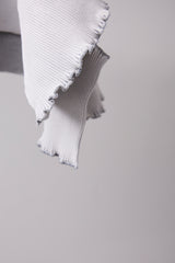 SEAMLESS DEFORMED DOLMAN SLEEVE/RIB