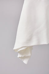 SEAMLESS DEFORMED DOLMAN SLEEVE/RIB