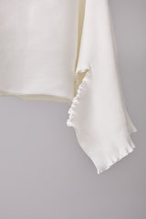 SEAMLESS DEFORMED DOLMAN SLEEVE/RIB