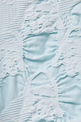 SEAMLESS DEFORMED THIN KNIT/COMPLEX