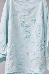 SEAMLESS DEFORMED DOLMAN SLEEVE/COMPLEX