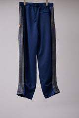 PIGMENT-DYED DISTRESSED TRACK TROUSERS