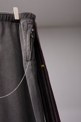 PIGMENT-DYED DISTRESSED TRACK TROUSERS