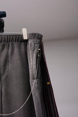 PIGMENT-DYED DISTRESSED TRACK TROUSERS