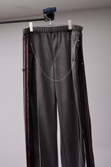 PIGMENT-DYED DISTRESSED TRACK TROUSERS