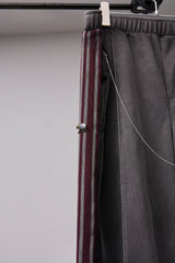 PIGMENT-DYED DISTRESSED TRACK TROUSERS