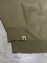 A BATHING APE (BAPE) × KAWS / “CHUM" NOSE ART GRAPHIC FULL-ZIP HOODIE (OLIVE DRAB)